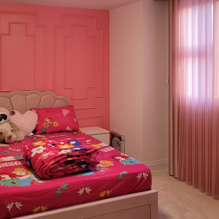 Pink sheer curtains in a girl’s bedroom
