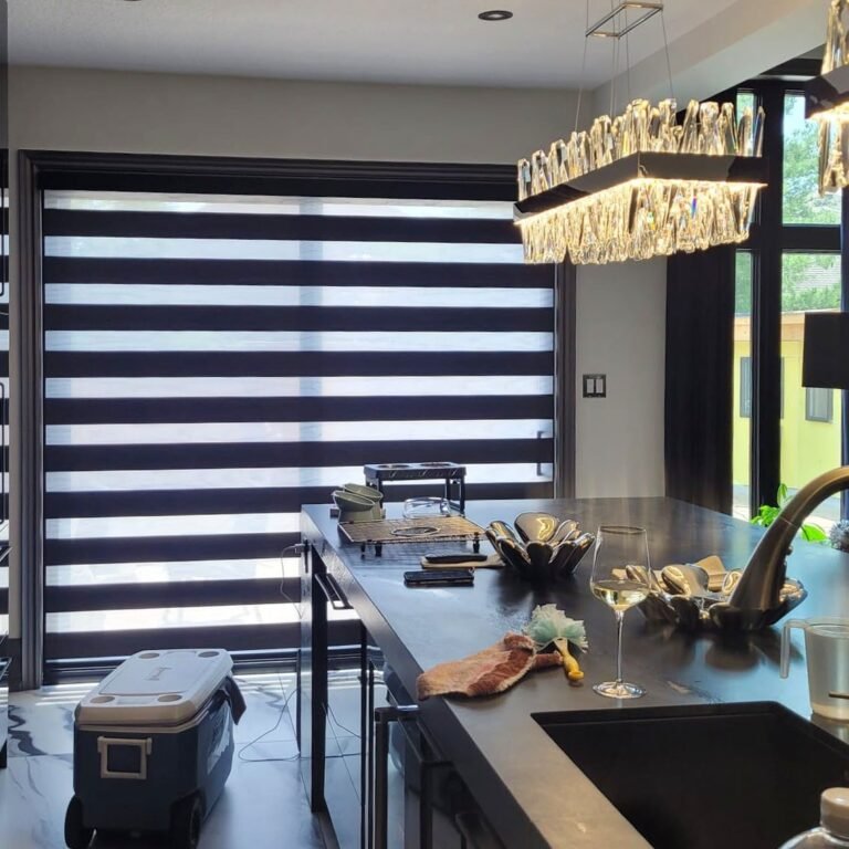 Dark zebra blinds on a window beside a kitchen island