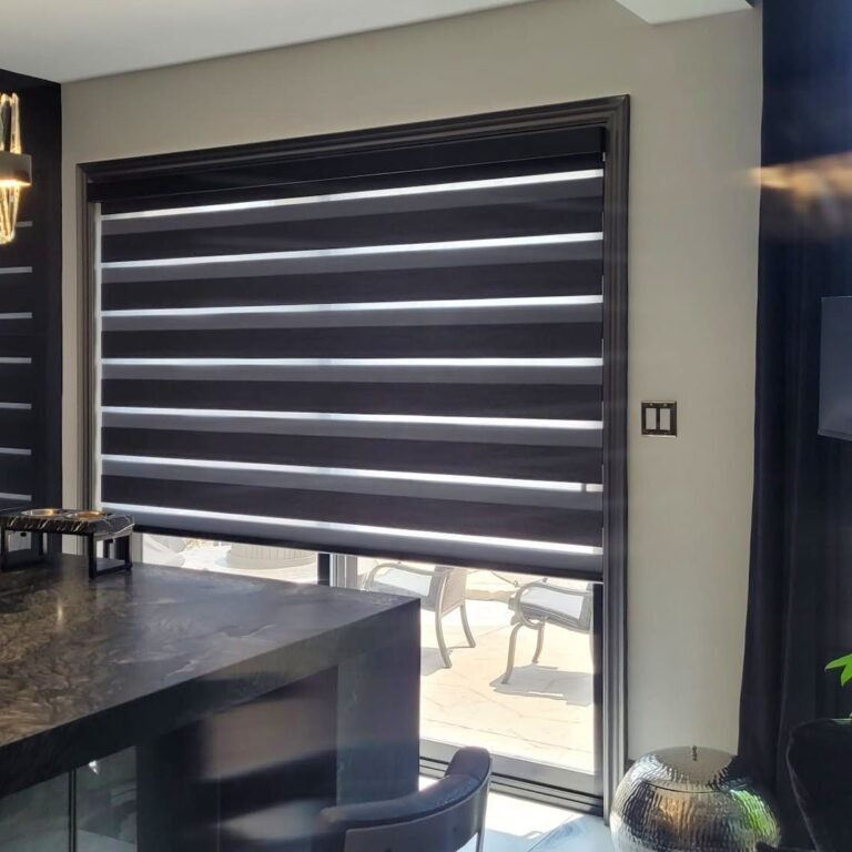 Charcoal zebra blinds on kitchen windows