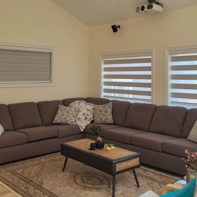 Zebra blinds on two windows in a basement family room