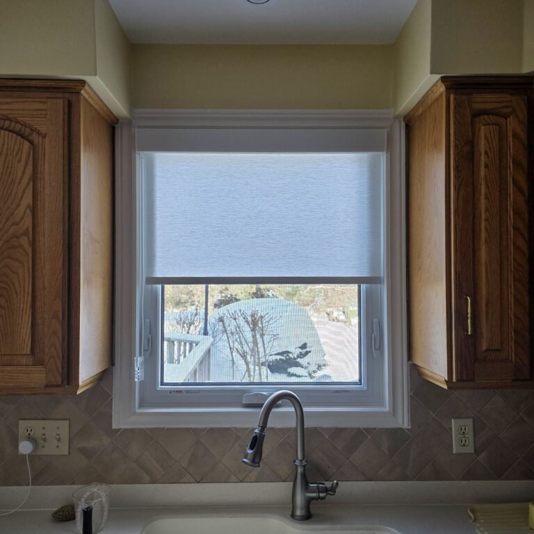 Light-filtering roller shade on a kitchen window