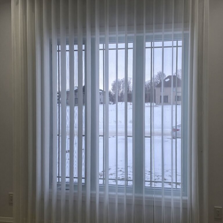 Vertical sheers drawn across glass doors
