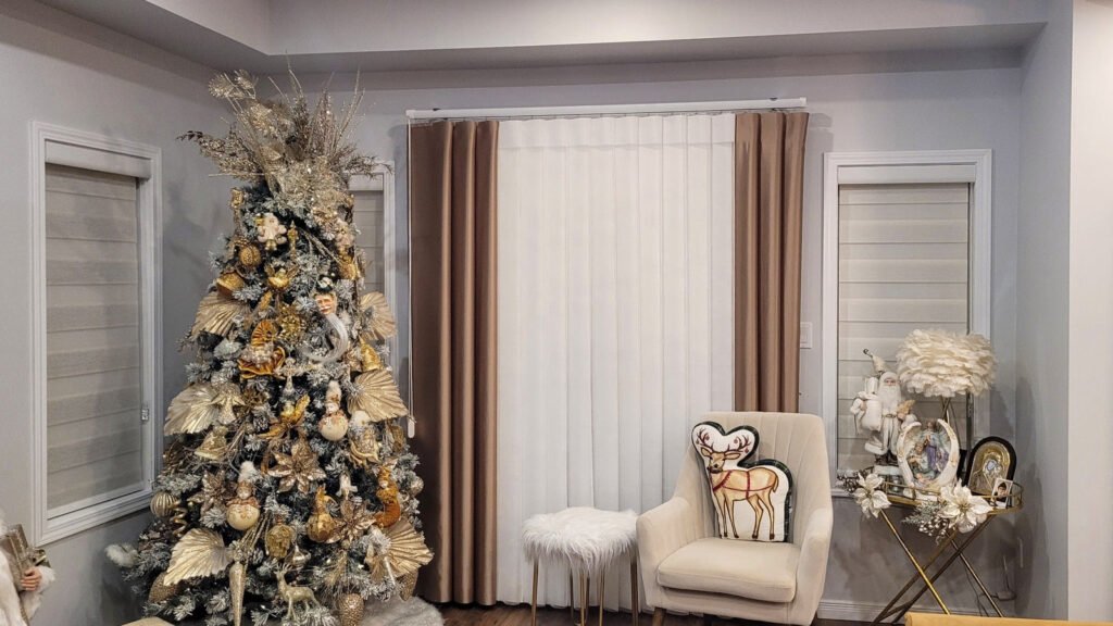 Vertical sheers with drapery panels in a living room decorated for the holidays