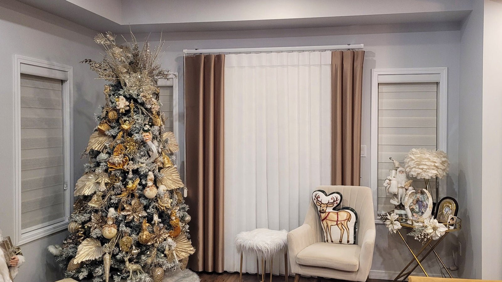 Vertical sheers with drapery panels in a living room decorated for the holidays