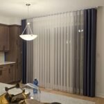 Two-tone vertical sheers on a large window in a modern living space