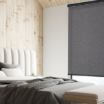 Dark Eco roller shade in a bedroom