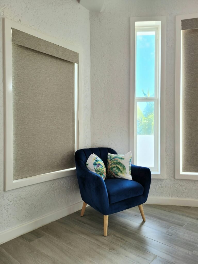 Light-filtering roller shades in a bright living room