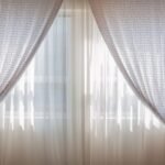 Sheer curtains drawn open in daylight