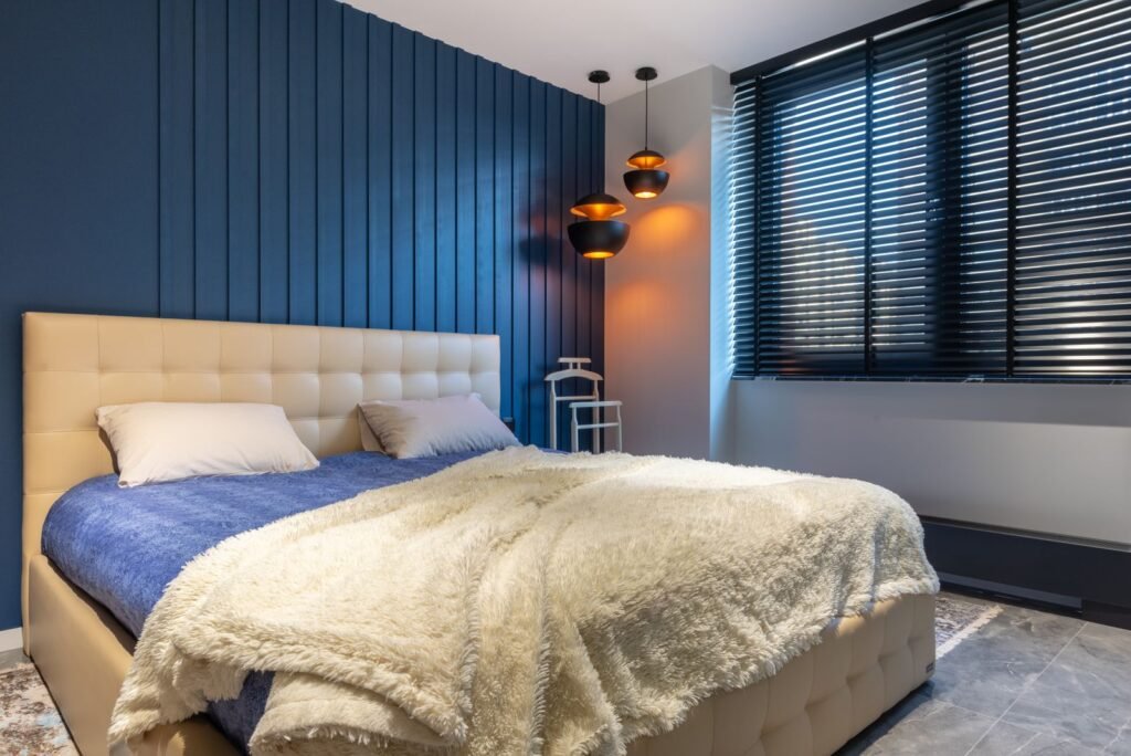 Room-darkening blinds in a navy bedroom