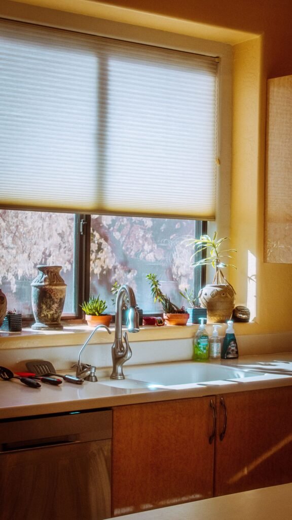 Pleated cellular shade above a kitchen window