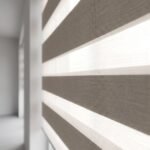 Close-up of alternating sheer and solid bands on a zebra blind